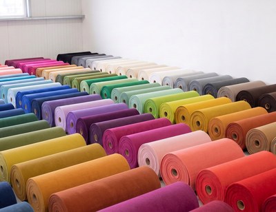 Stock rolls of colorful event carpet waiting to be cut to size